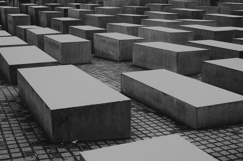 day, tarmac, floor, outdoors, maze, travel destinations, wood, labyrinth, pattern, no people, walkway, word, banister, sidewalk, monument, ground, war memorial