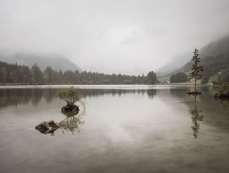 beauty in nature, sky, tranquil scene, plant, mountain, foggy, reflection, calm, idyllic, tree, water, opaque, day, waterfront, reflection lake, outdoors