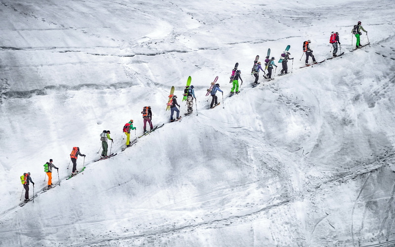 skiing, in a row, adult, young adult, snow, motion, mature men, sport, athlete, mountain, group of people, day, young men, winter, real people, extreme weather