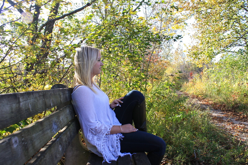 white, thinking woman, beautiful woman, young women, woman, plant, hair, three quarter length, side-profile, full length, day, outdoors, jeans, tree, real people