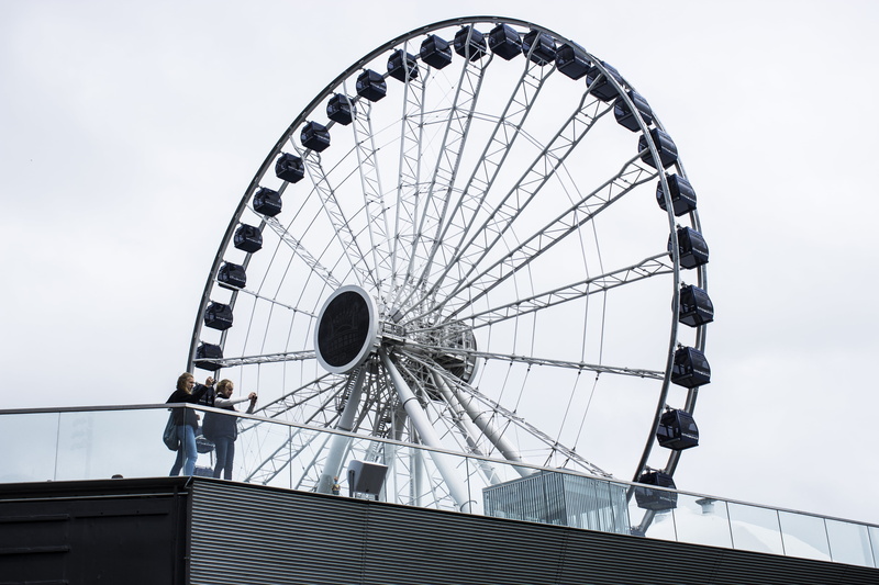 architecture, people, daytime, clear sky, low angle view, outdoors, metal, selfie, near, wheel, amusement park ride, two, steel, sky, black, real people
