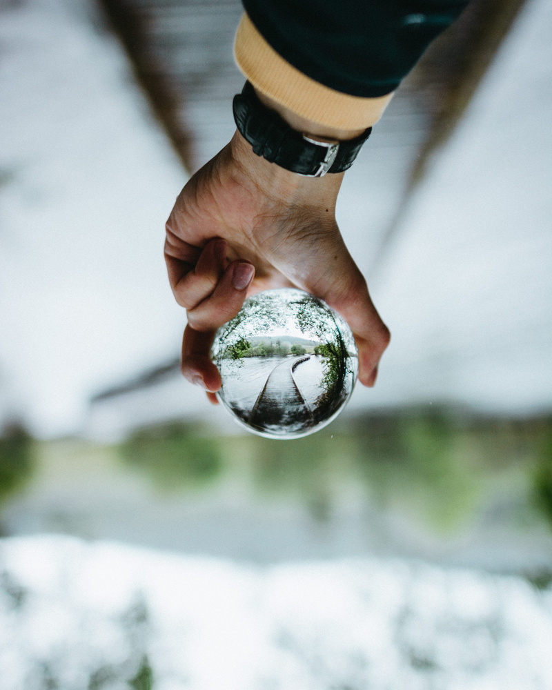 human limb, blur, glass, person, holding, clear, reflection, nature, 4K, close-up, finger, sphere, day, glass ball, focus on foreground, glass - material