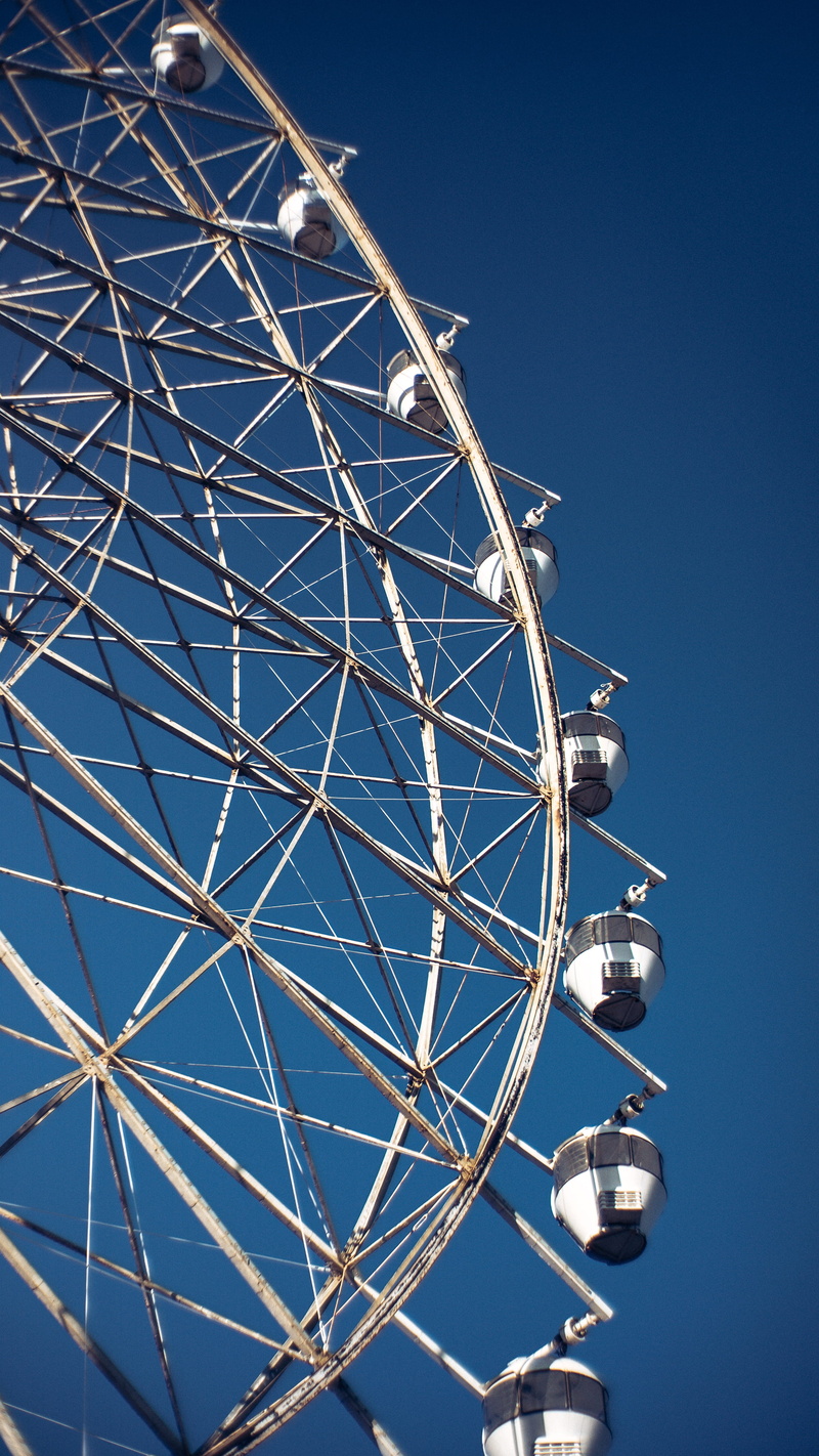 low angle view, ferris wheel, carnival, blue, day, outdoors, spoke, nature, clear sky, tagaytay, fairground, plywood, adventure, crowd, no people, amusement park