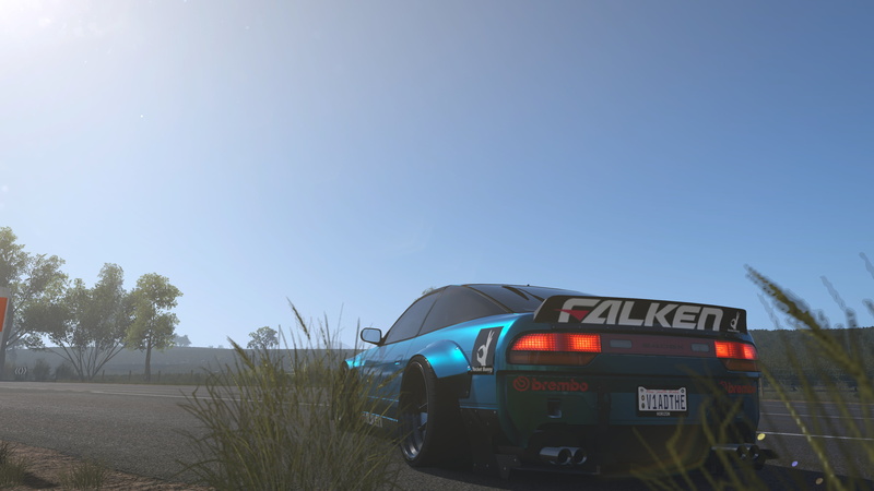 outdoors, motor vehicle, sky, Forza Horizon, tree, nature, blue, transportation, communication, plant, sign, car, clear sky, text, land vehicle, forza horizon 3
