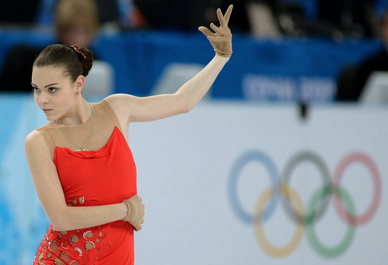 sleeveless, sport, young adult, skater, arms raised, waist up, human arm, figure skating, lifestyles, standing, red, emotion, teenager, young women, look