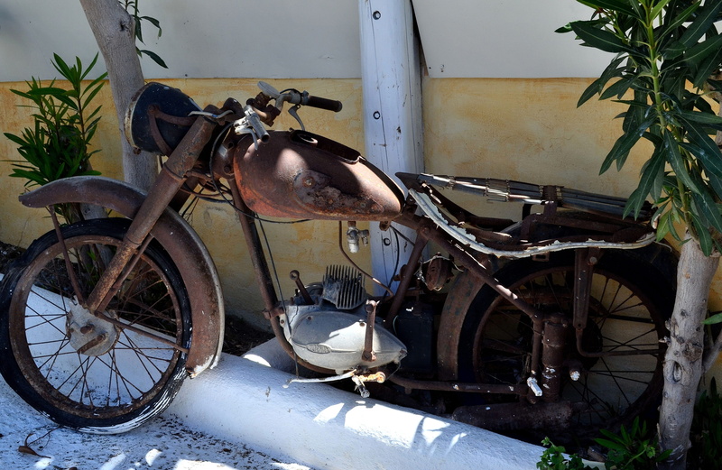 decoration, wheel, wall - building feature, metal, close up, nostalgic, garage, Motorcycle, run-down, day, transportation, locomotion, broken, indoors