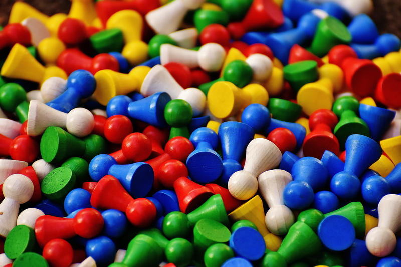 wood, 5K, large group of objects, still life, multi colored, play, indoors, selective focus, close-up, directly above, game characters, candy, children
