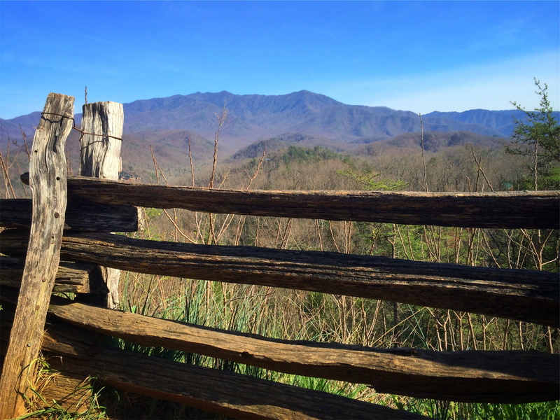 fields, mountain, scenics - nature, landscape, outdoors, tranquility, boundary, countryside, wooden, railroad track, sunshine, mountain range, rural, sunny