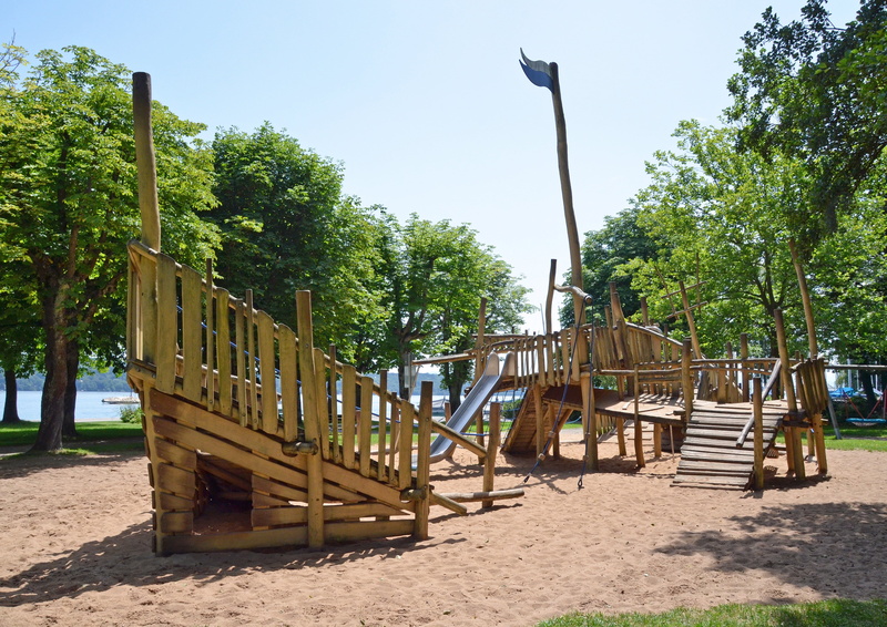 wood - material, jungle gym, no people, built structure, empty, outdoor play equipment, architecture, swing, park - man made space, slide, clear sky, children