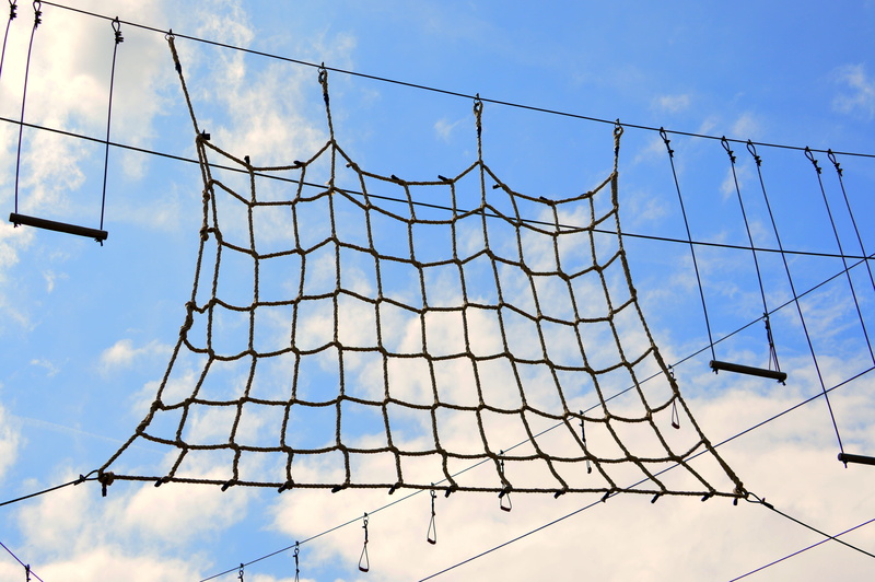 low angle view, metal, adventure, holding on, 5K, climb, sunlight, skill, day, shape, cable, sky, entertainment, adventure park, cloud - sky, built structure