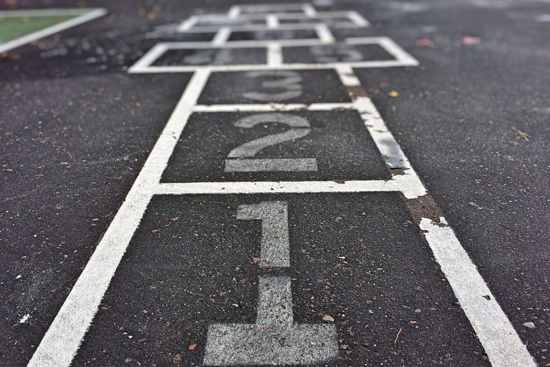city, 2K, white color, hopscotch, day, road marking, no people, street, playground, high angle view, relaxation, sign, game, number, black, leisure activity