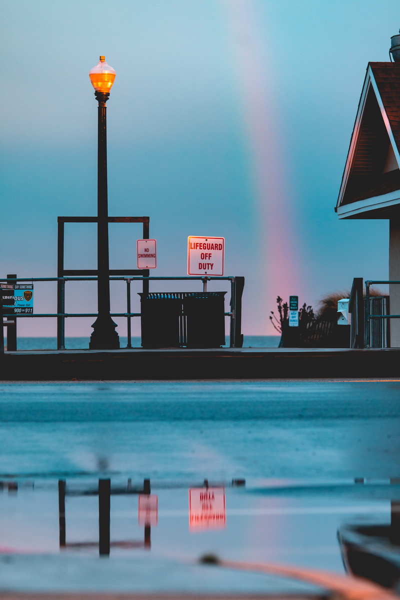 lampost, communication, day, black, photography, city, lighting equipment, text, building exterior, western script, incidental people, brown, nature, illuminated