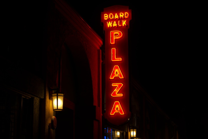 building exterior, red, turned, building, sign, street, black, nightlife, board, outdoors, pool cue, built structure, text, signage, lighting equipment