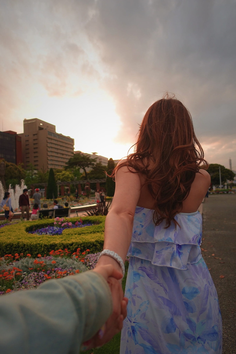 dress, females, floral, adult, blue, turning, front, back, nature, lifestyles, cloud - sky, holding, real people, outdoors, young Adult, white, casual clothing