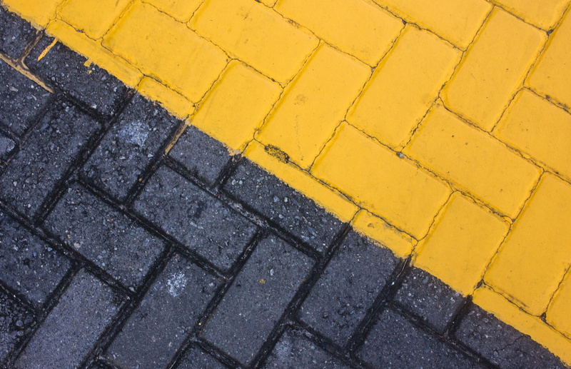 black color, raod, symbol, sidewalk, road marking, pavement, road, yellow, dividing line, black, no people, transportation, high angle view, pattern, bricks