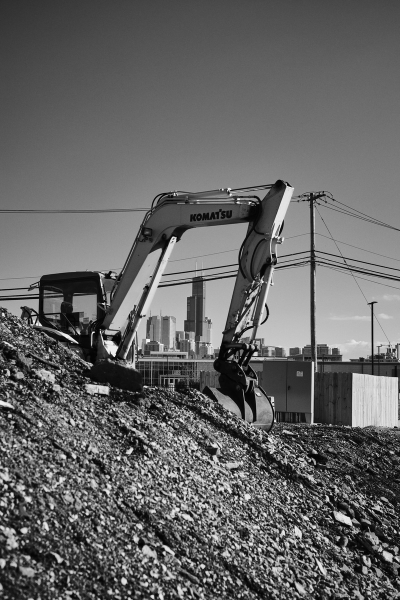 nature, dirt road, crane - construction machinery, copy space, sky, one person, road, real people, soil, clear sky, street photography, skyscraper, bulldozer