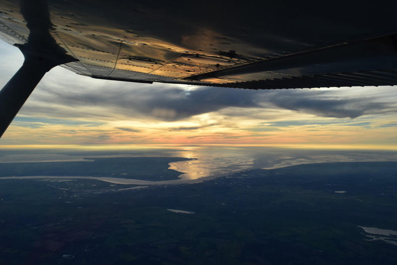 fly, outdoors, aircraft wing, cessna, wing, vehicle interior, beauty in nature, mode of transportation, sunset, window, air vehicle, flying, sun, evening sun