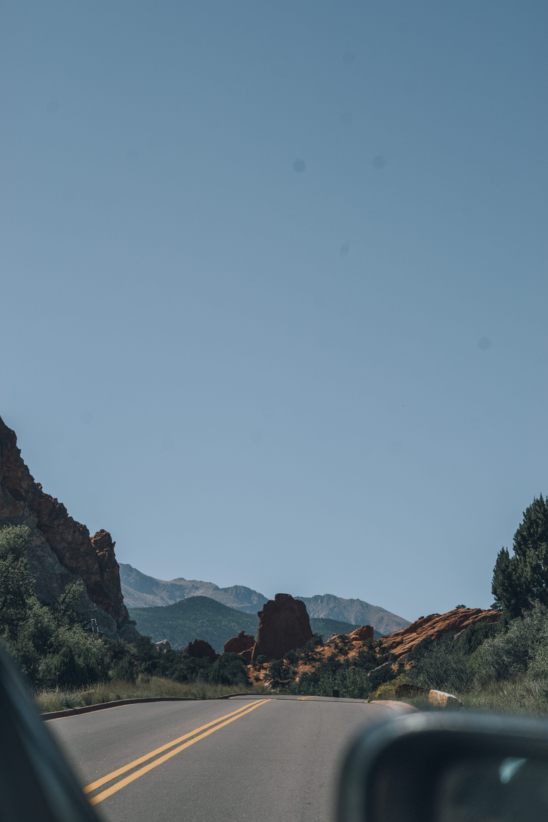outdoors, sky, trees, clear sky, on the move, colorado, road, open road, garden of the gods road, car, 5K, road trip, the way forward, car point of view