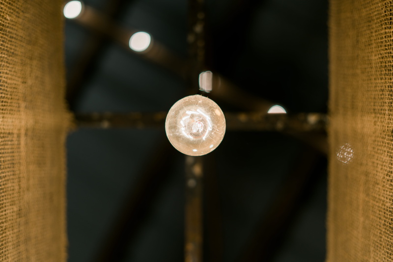 indoors, bokeh, single object, close, circle, focus on foreground, adison hardyway, close-up, 8K, bullet, photo, glass, sony a7rii, round, reflection