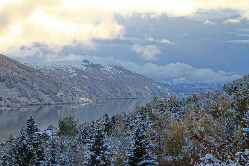 cloud - sky, tranquil scene, water, snow, pine tree, clouds, mountain, hills, winter, tranquility, body, outdoors, non-urban scene, no people, cold temperature