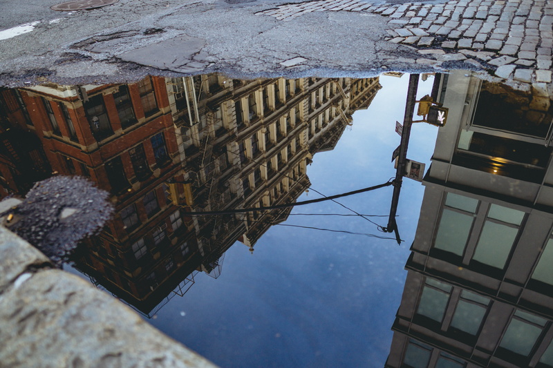 water, puddle, building, reflection, new york, high angle view, street, wet, intersection, standing water, nyc, day, built structure, canal, outdoors, architecture