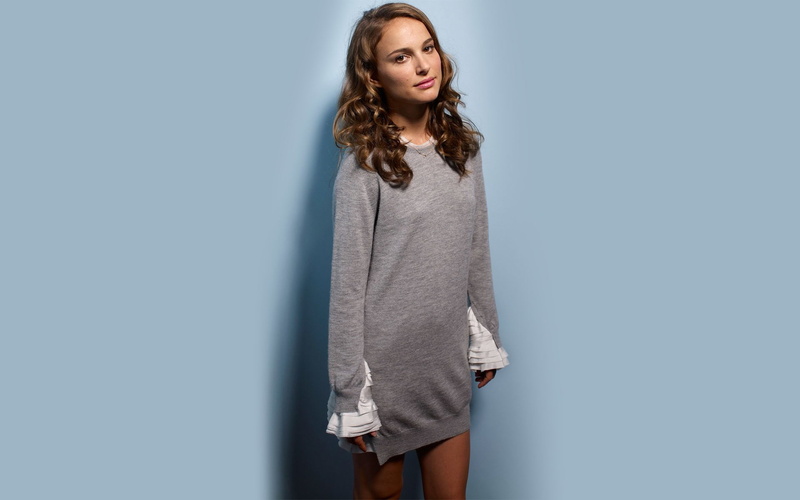 long hair, hairstyle, beautiful woman, casual clothing, Natalie Portman, indoors, blue background, contemplation, beautiful people, clothing, young adult