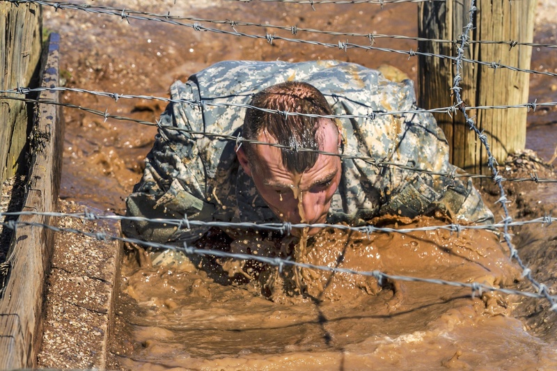 persistence, service, crawling, wire mesh, metal, safety, men, day, exercise, obscured face, real people, perseverance, military, protection, strength