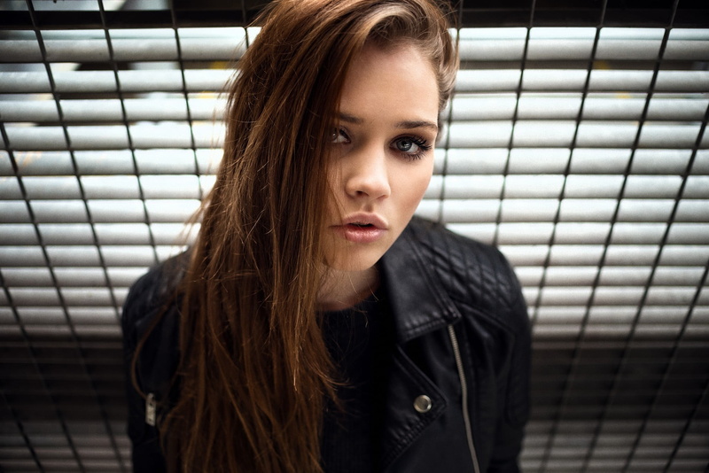 real people, open mouth, brunette, adult, front view, leather, looking, women, young adult, pink lipstick, black sweater, beautiful woman, hair, looking at camera