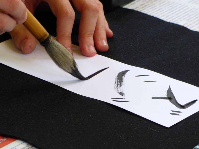 art and craft, black color, human body part, paper, characters, calligraphy, human finger, body part, hand, abstrac, person, white, finger, japan, real people
