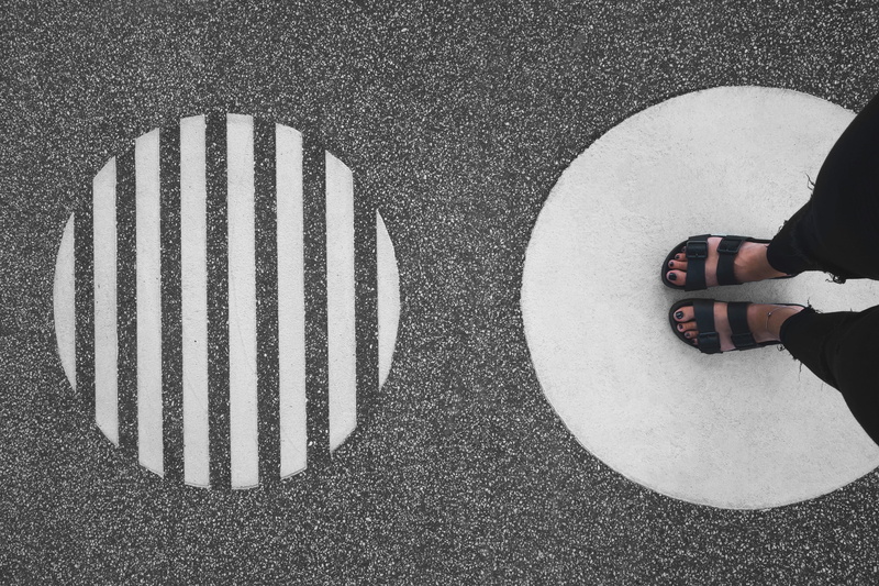 manhole, blackandwhite, person, future, low section, design, day, human leg, road, directly above, city, floor, one person, abstract, sign, outdoors, pattern