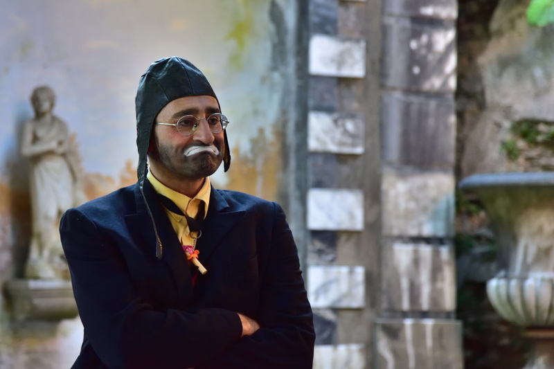 architecture, mask, italy, men, smiling, standing, mouth, day, eyes, waist up, lifestyles, real people, look, well-dressed, looking at camera, clown, eyeglasses