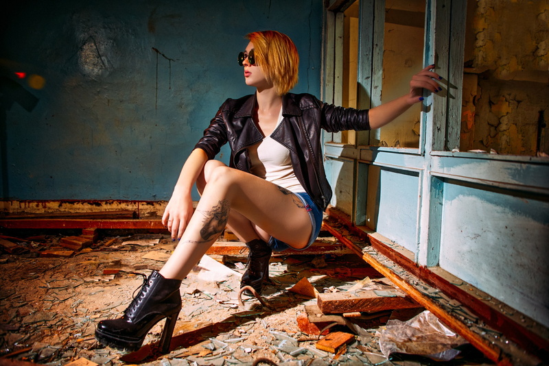 blonde, black jackets, women with shades, squatting, indoors, leather jackets, 2K, painted nails, abandoned, tattoo, model, jean shorts, tank top, inked girls