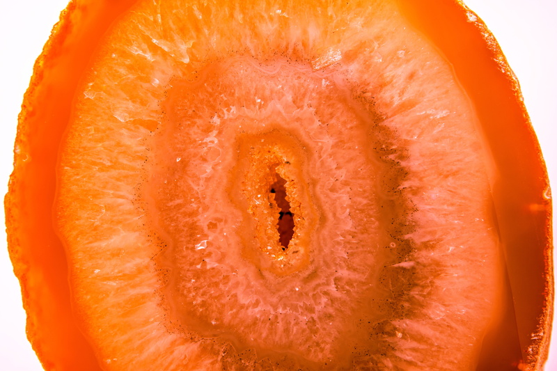 cross section, no people, semi precious stone, orange - fruit, orange color, wellbeing, agate, citrus fruit, single object, freshness, close-up, rays, extreme close-up