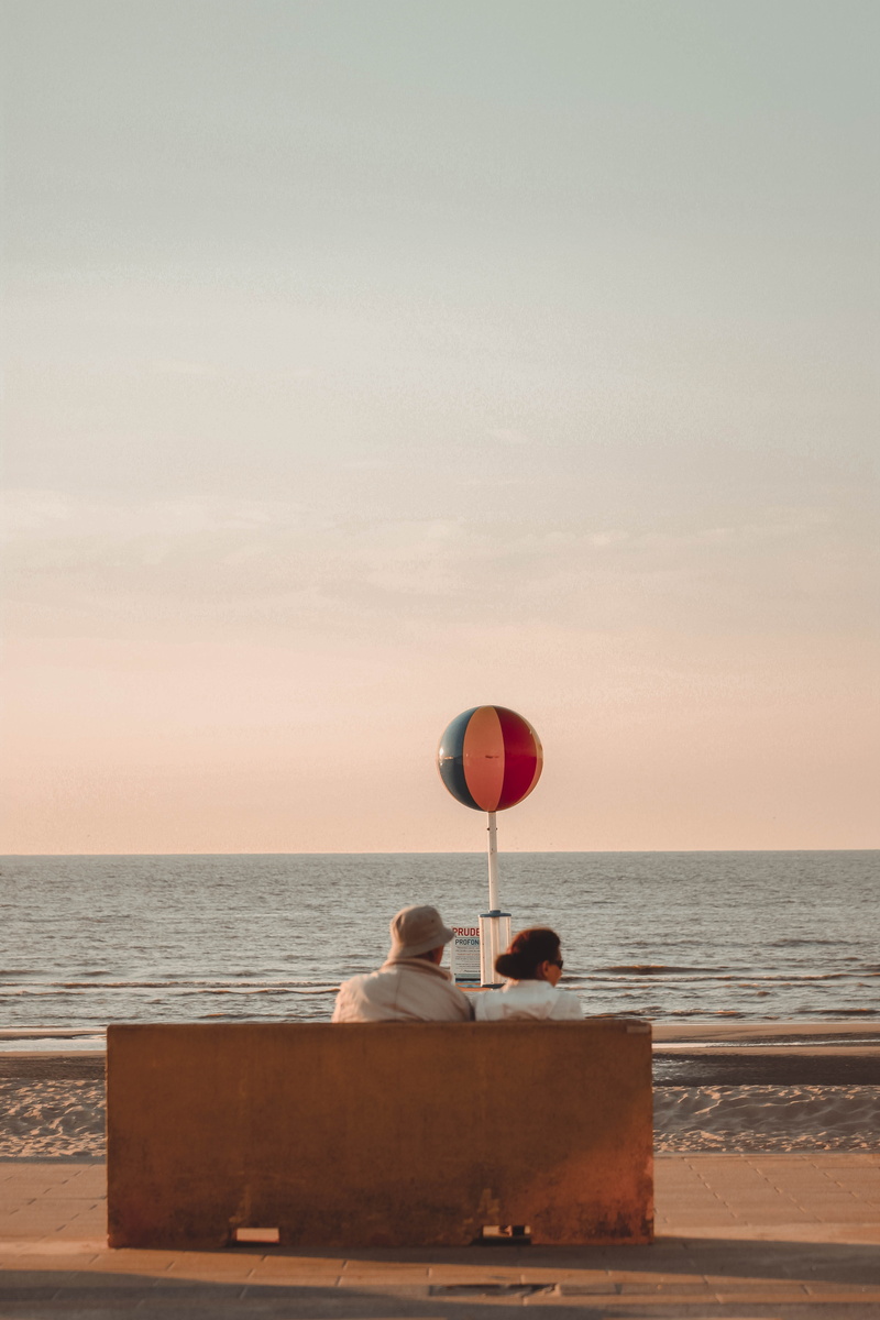 person, shore, real people, outdoors, adult, candid, women, sitting, ocean, watercraft, looking out, sunset, woman, positive emotion, sky, leisure activity