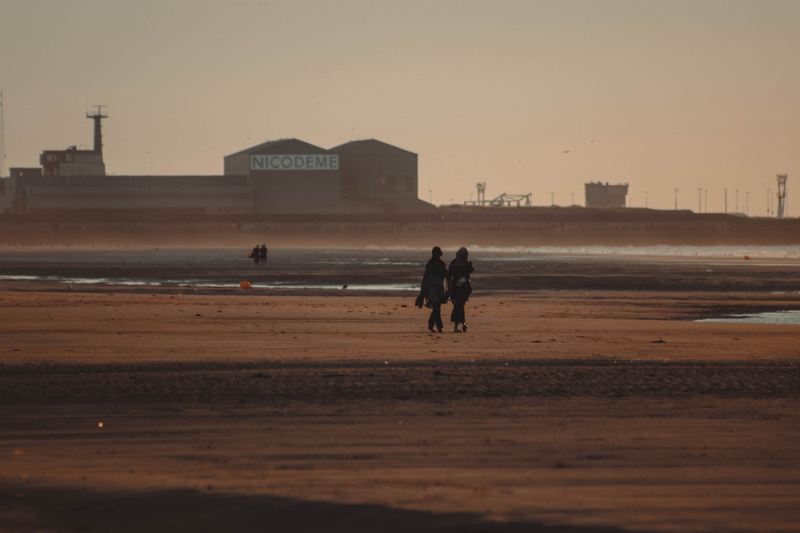 nature, sand, real people, building exterior, clear sky, built structure, beach, architecture, people, dunkirk, water, lifestyles, sky, sea, stranger, men