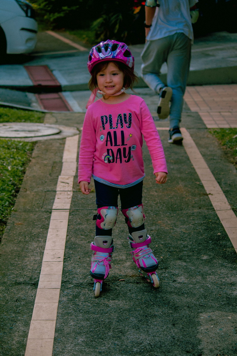 people, shoe, outdoors, clothing, sport, women, kid, car, person, footwear, full length, baby, females, automobile, vehicle, girl, footpath, human, day