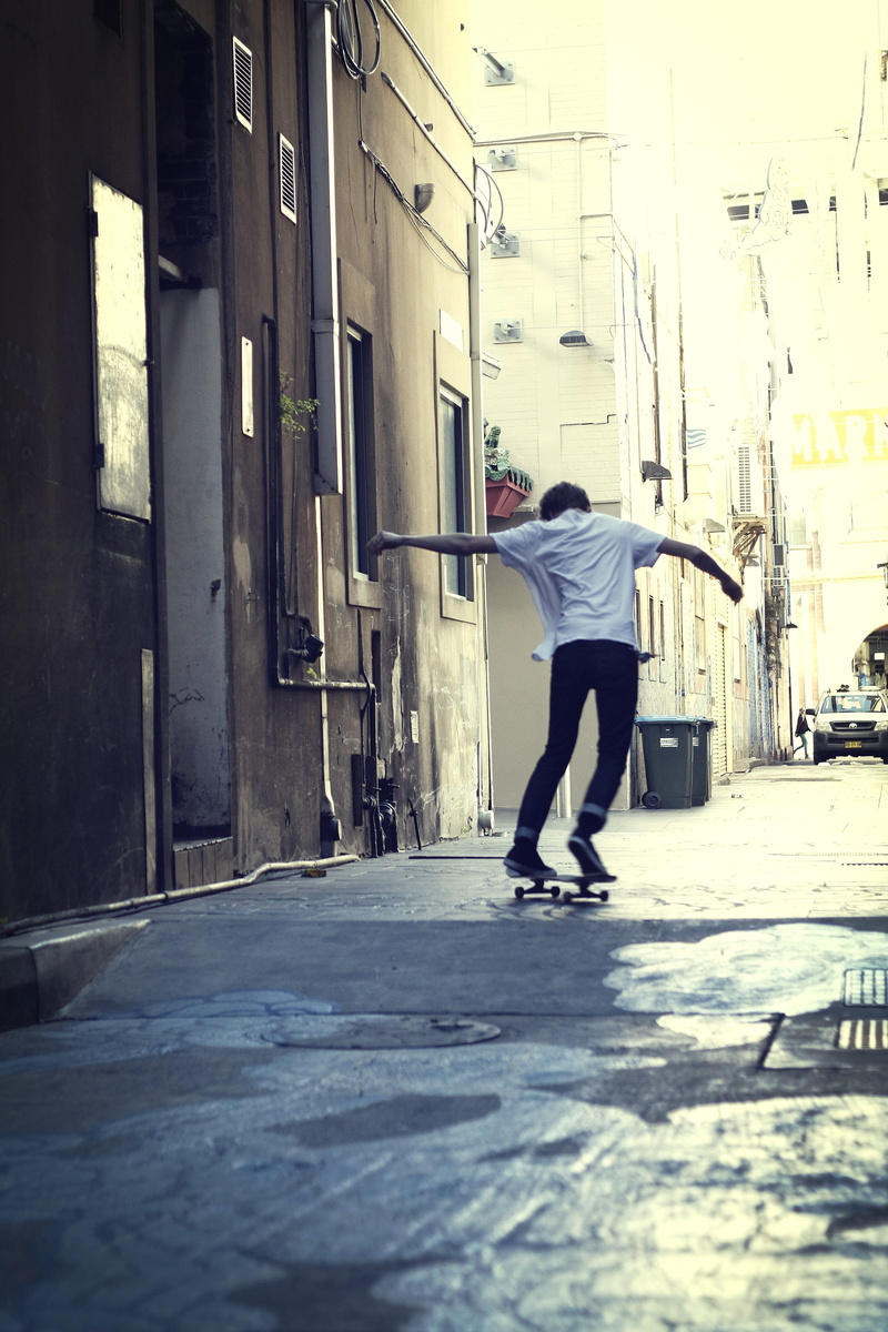 full length, skating, olly, built structure, shoes, girl, urban, footpath, active, action, copy, dynamic, downtown, sports equipment, skateboard, lifestyle