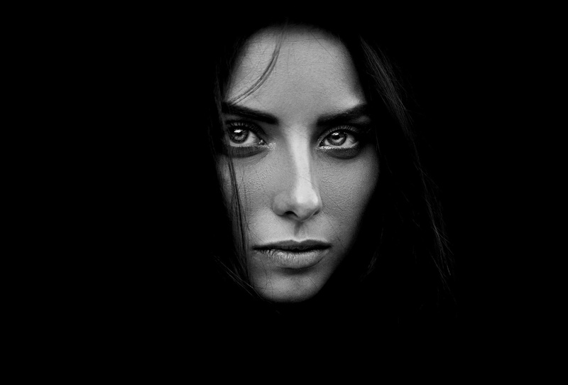 portrait, monochrome, one person, front view, looking at camera, beautiful woman, Ann Nevreva, human body part, black background, close-up, young adult