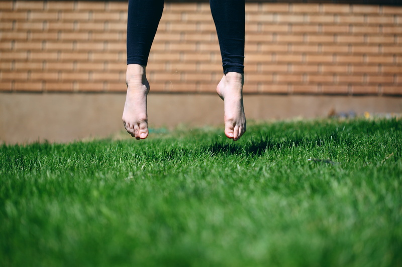 fresh, field, air, outdoor, human foot, jump, grass, wall, plant, legs, fashion, wearing, day, leggings, person, summer, 5K, selective focus, garden, brick wall