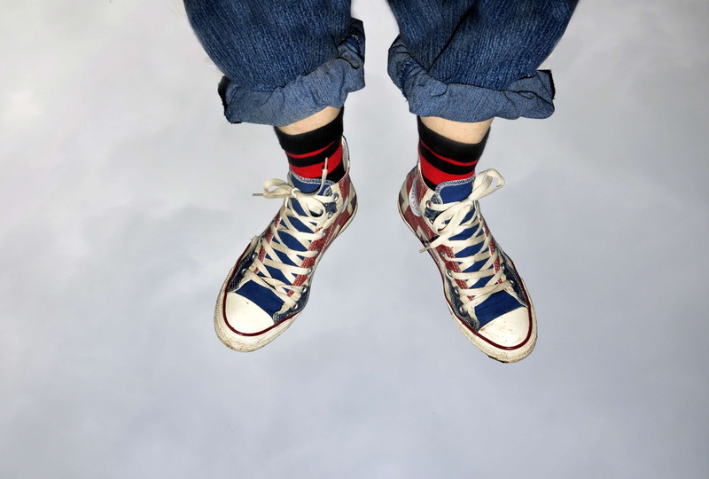 shoe, human body part, sock, woman, jumping, 2K, human leg, sky, one person, body part, jeans, limb, child, feet in the air, low section, striped, lifestyles