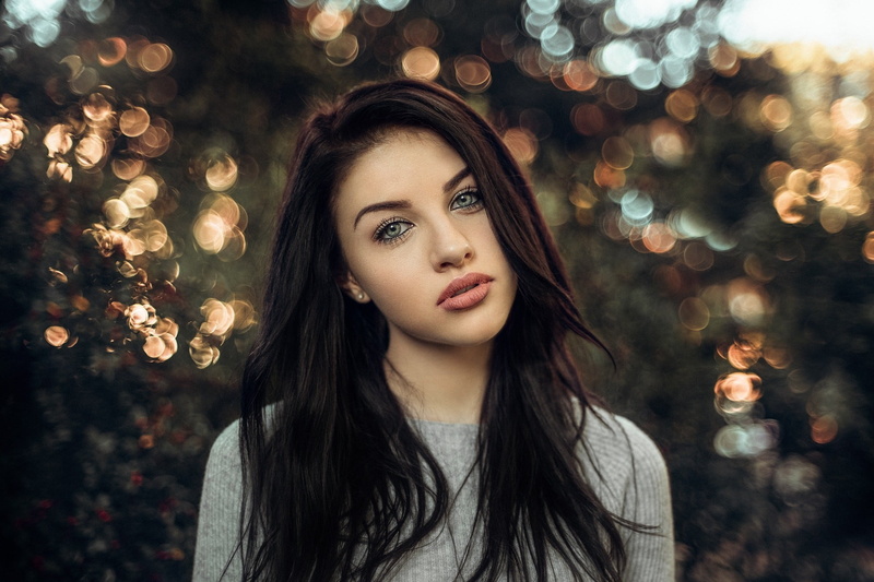 depth of field, front view, headshot, hairstyle, brown hair, focus on foreground, young women, portrait, long hair, young adult, looking at camera, outdoors