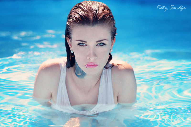 hairstyle, 1080P, looking at camera, adult, swimming pool, outdoors, beautiful woman, nose rings, wet body, pool, water, young adult, nature, portrait