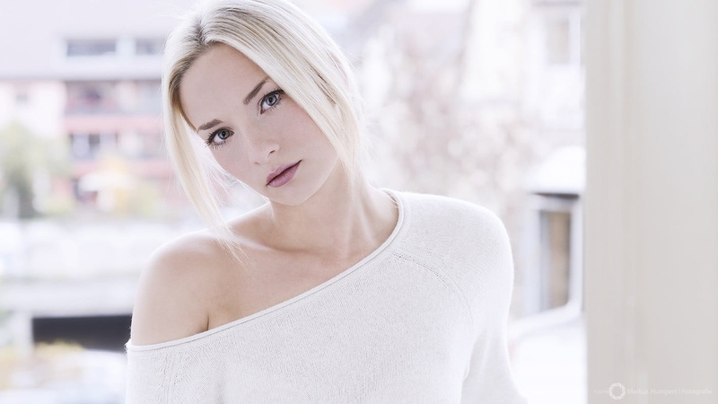 white sweater, headshot, hairstyle, adult, confidence, contemplation, portrait, looking at camera, blond hair, front view, hair, casual clothing, women