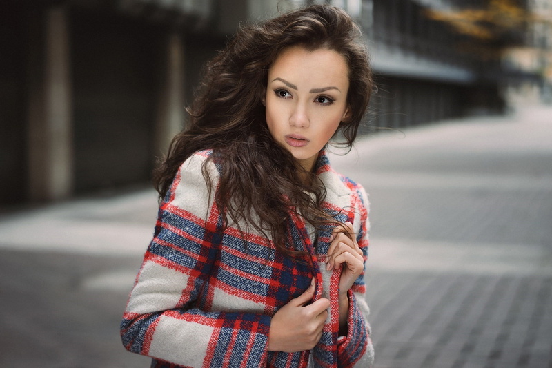 beautiful woman, hairstyle, clothing, architecture, scarf, portrait, one person, fashion, beauty, sweater, brunette, brown hair, cardigan sweater, warm clothing