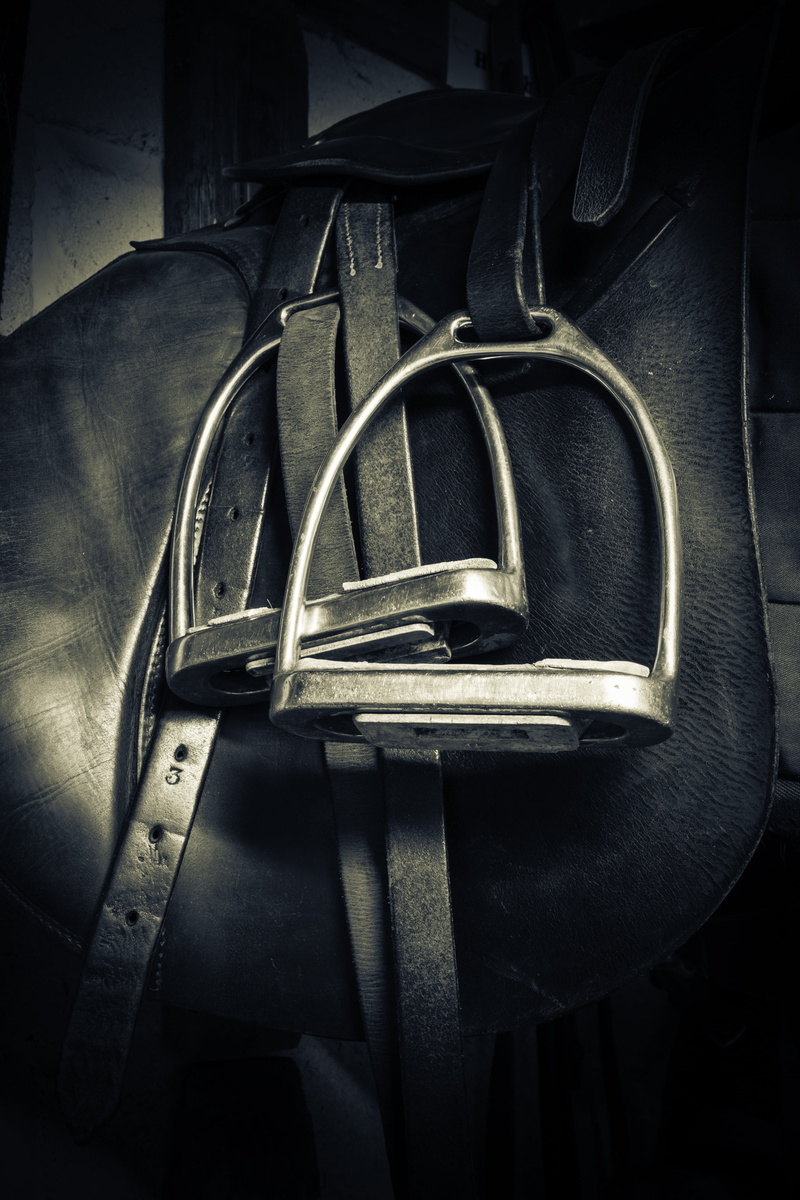 still life, indoors, seat, stirrups, ride, 5K, equine, wood - material, mode of transportation, close-up, saddle, vignette, chair, equipment, leather