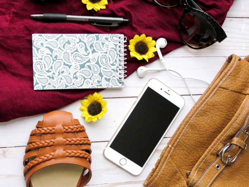 leather, wireless technology, lay, mobile phone, sunflowers, table, portable information device, connection, fashion, headphones, close-up, screen, red