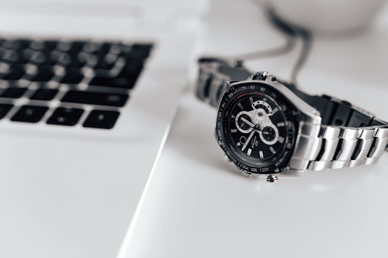 studio shot, white, 2K, workplace, laptop, white laptop, silver colored, clock, silver watch, essentials, keyboard, watch, close-up, number, computer equipment