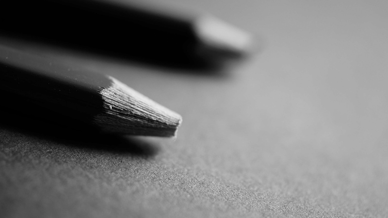 textured, self improvement, black color, communication, selective focus, table, single object, writing instrument, art and craft, close-up, fountain pen