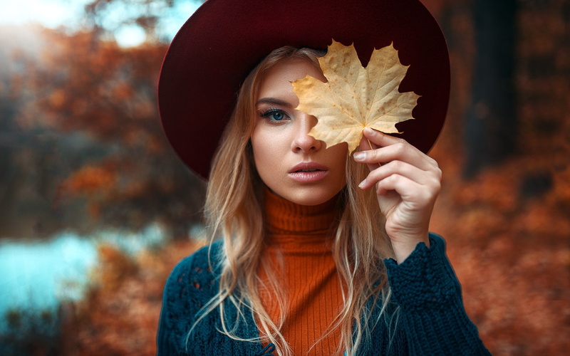 leaves, front view, 1080P, autumn, blond hair, young women, hair, blue eyes, depth of field, blonde, outdoors, long hair, one person, teenager, focus on foreground