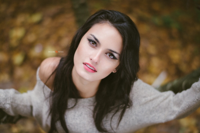 brown hair, headshot, eyeliner, outdoors, human arm, front view, teenager, one person, leisure activity, beautiful woman, looking at viewer, closeup, beauty